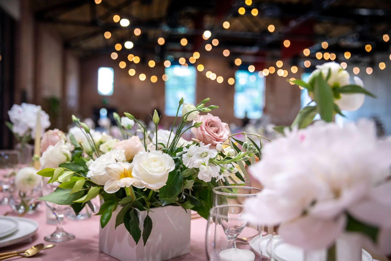 Beautiful floral centerpiece with roses at wedding table