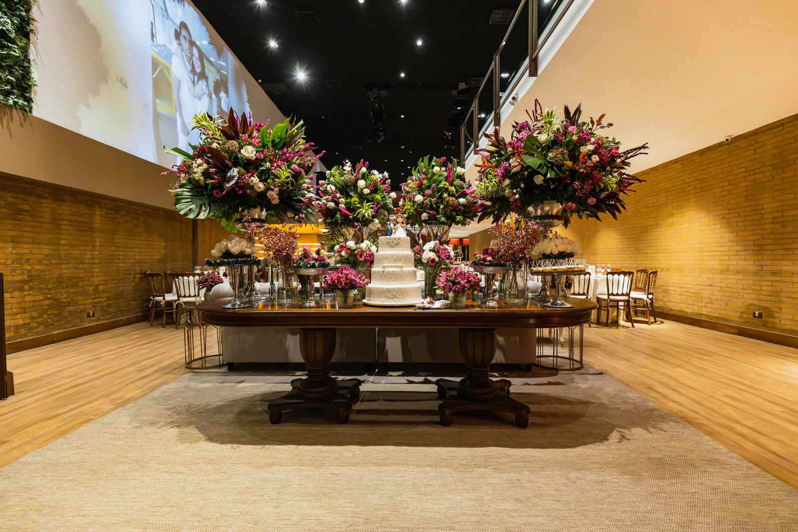 Luxurious wedding reception table with flowers and cake
